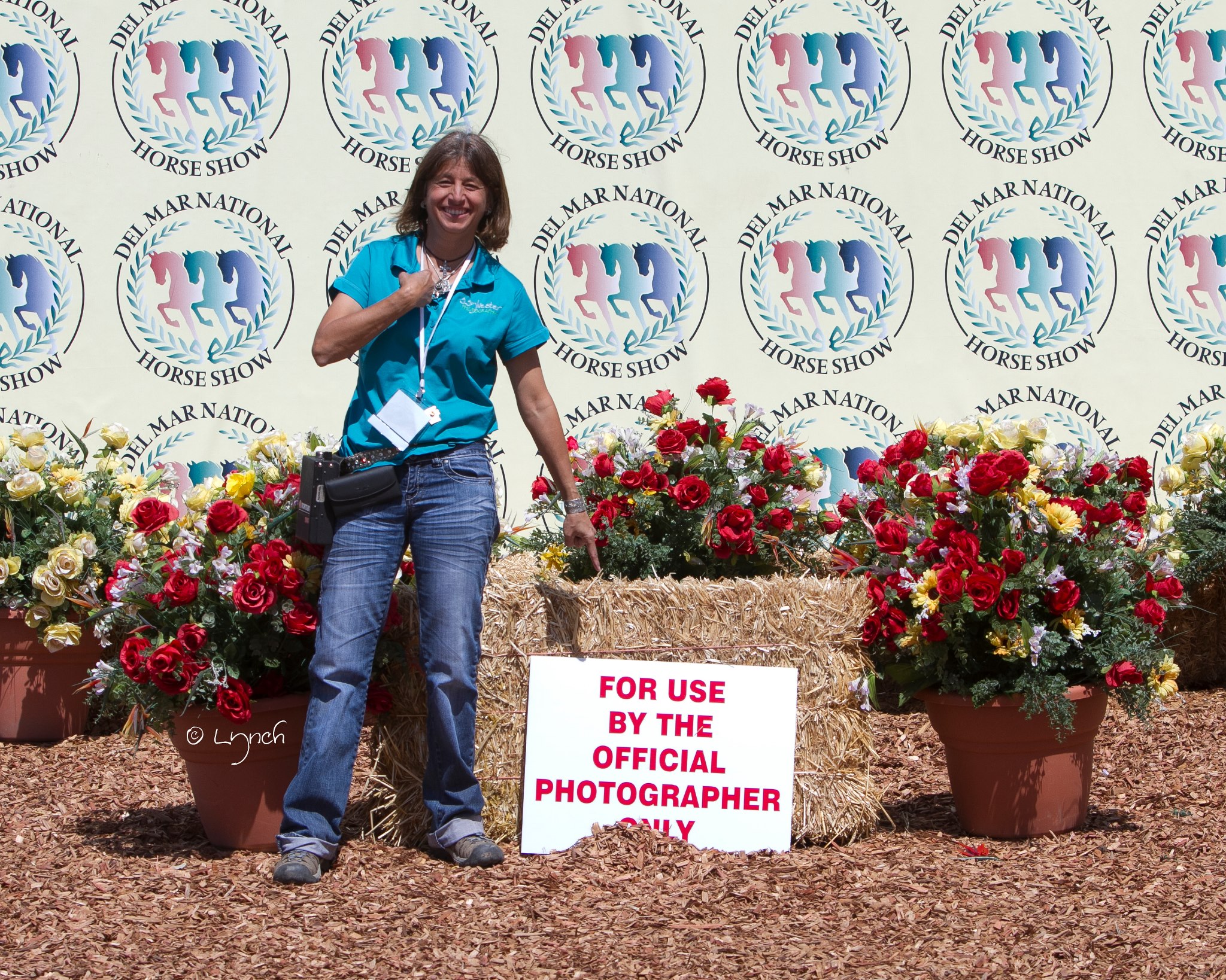 Equine photographer working behind the scenes at a horse show